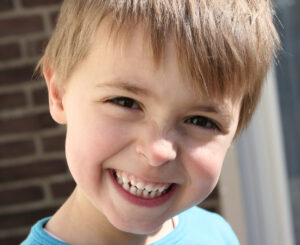 Smiling kid goes for his dental checkups with a Mechanicsville family dentist.