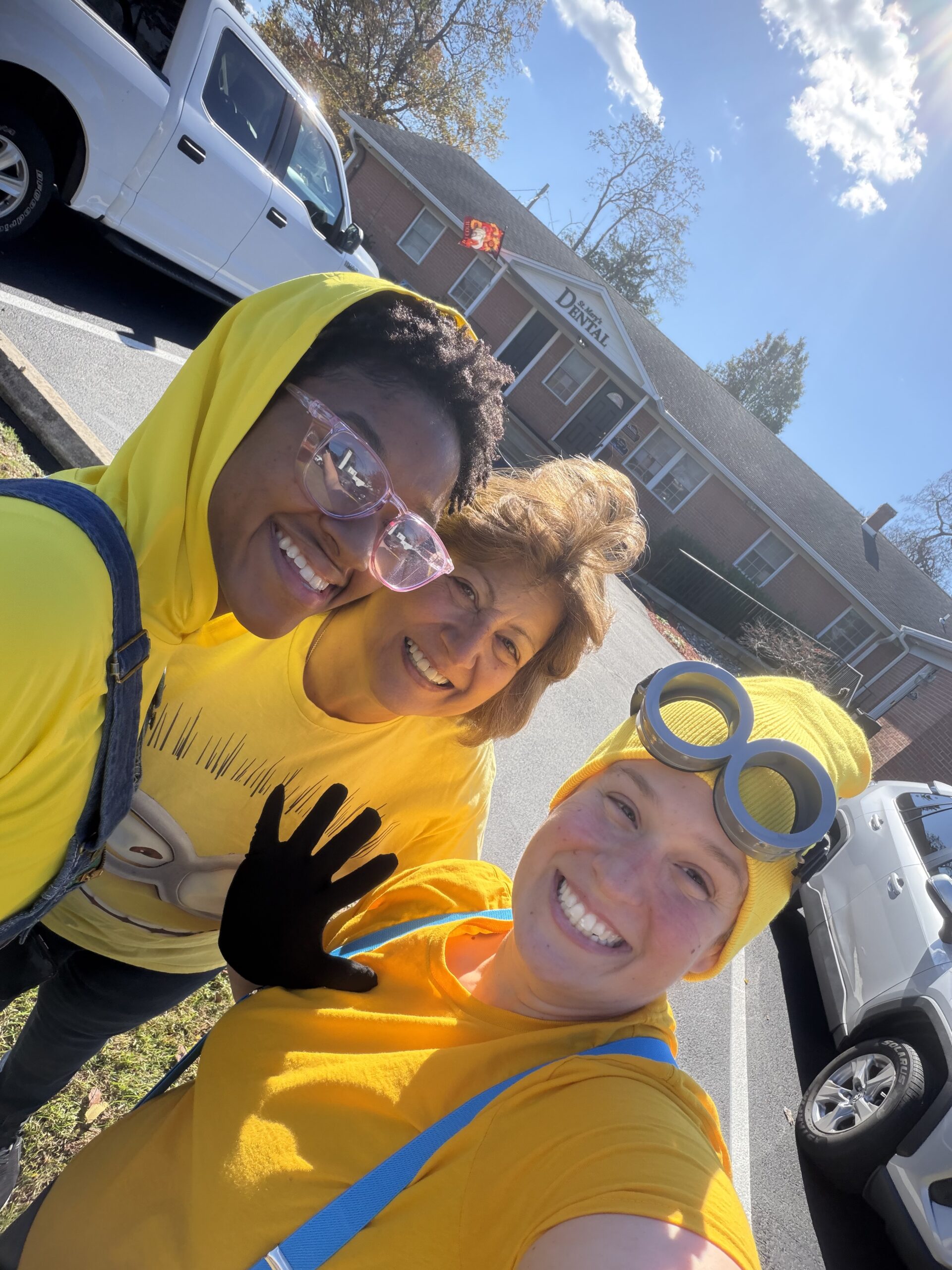 St. Mary’s Dental team members dressed as Minions for Halloween outside the dental office in Mechanicsville.
